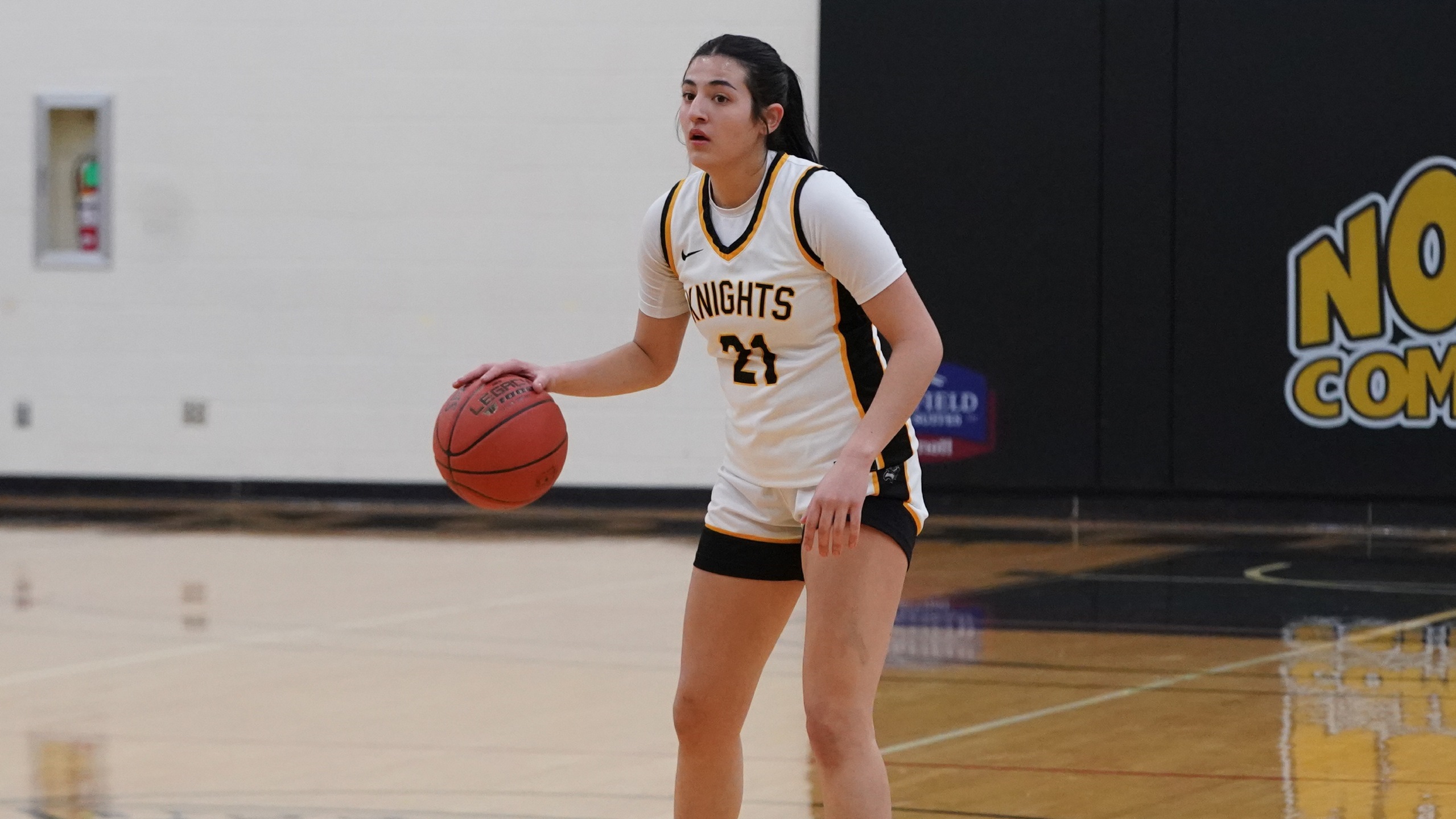 Knights hold off late Trojans rally